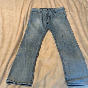 Light wash faded slim jeans.